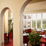The Brasserie restaurant at Mercure Leeds Parkway Hotel, tables by the window looking out onto the grounds